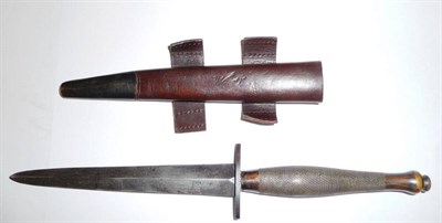 Lot 188 - A Commando Fighting Knife, Second Pattern, with hand forged steel blade, brass grip and brass...