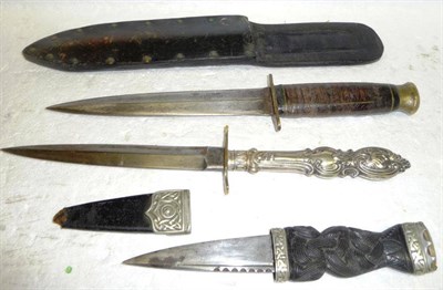 Lot 190 - A Skein Dhu, with scallop back steel blade, ebony grip with Celtic knot carved decoration and...