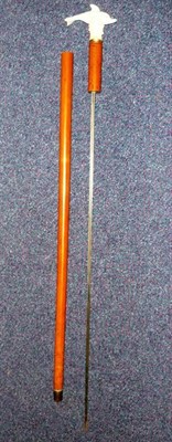 Lot 194 - A Malacca Sword Stick, with 67cm fullered triangular section steel blade, the grip with...