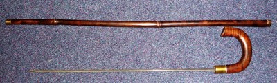 Lot 214 - A Bamboo Sword Stick, with 57cm square tapering stiletto blade, brass ferrule and collar, and...