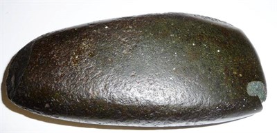 Lot 215 - A Maori Greenstone Axe Head, of rounded oblong form, bearing an old paper label inscribed...