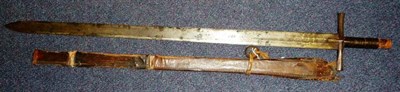 Lot 220 - A 19th Century Sudanese Kaskara, the 91cm double edge steel blade with spatulate tip, the cruciform