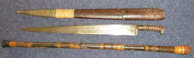 Lot 227 - A 19th Century Khyber Knife, the 55cm T section steel blade with a narrow fuller to the top...