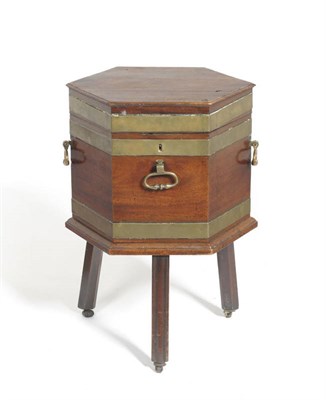 Lot 1539 - A George III Mahogany and Brass Bound Hexagonal Wine Cooler, early 19th century, the hinged lid...