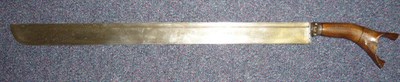 Lot 250 - A Malayan Parang Type Sword, the 54cm broad straight damascened steel blade with a narrow fuller to