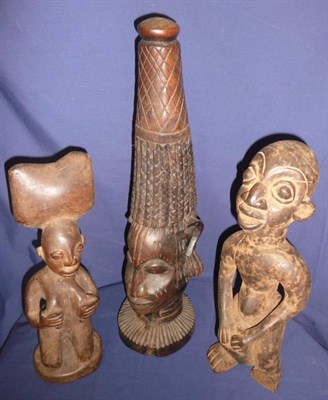 Lot 254 - A Bamileke Wood Figure of a Drummer, standing, playing a drum set between his legs, 40cm; a...