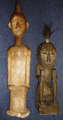 Lot 257 - A Ndengese Type Wood King Figure, the oval head with swept back conical horn coiffure, large...