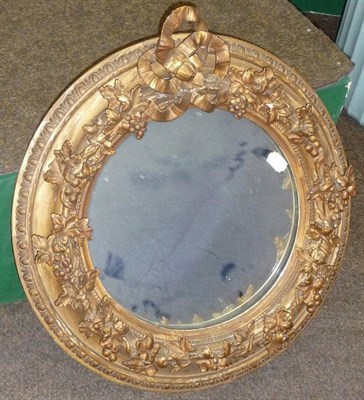 Lot 1543 - A Victorian Gilt Gesso Wall Mirror, late 19th century, the circular plate within an elaborate...