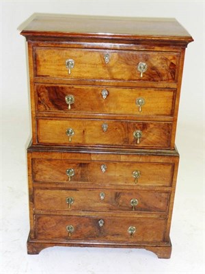 Lot 1544 - A Walnut Chest on Chest, of small proportions, the crossbanded and moulded top above three long...