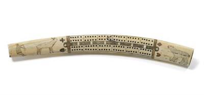 Lot 283 - A Late 19th/ Early 20th Century Scrimshaw Work Walrus Tusk Cribbage Marker, one side well decorated