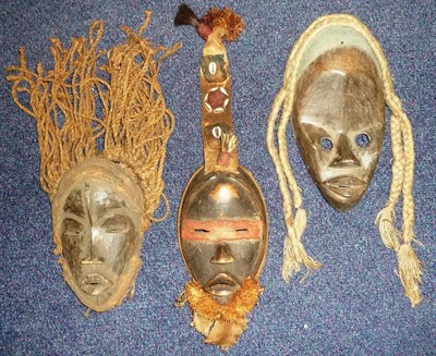 Lot 290 - Three Dan Wood Face Masks, each of oval form with domed forehead, slit eyes, triangular nose...