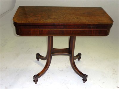 Lot 1555 - A Regency Rosewood and Boxwood Strung Foldover Card Table, early 19th century, the green baize...