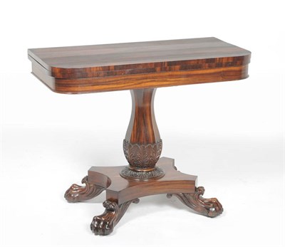 Lot 1556 - A William IV Goncalo Alves Foldover Tea Table, mid 19th century, the rounded rectangular top...