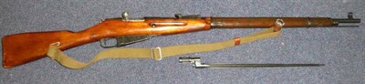 Lot 419 - A Deactivated Russian Mosin Nagant Bolt Action Carbine, numbered BO 6546 and dated 1942, with...