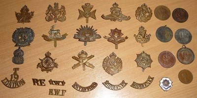 Lot 54 - A Collection of Twenty One Brass Military Cap Badges and Shoulder Titles, a silver ARP badge, a...