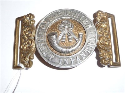 Lot 101 - A Silver Mounted Brass Belt Clasp to the Oxfordshire Light Infantry, with central circular...