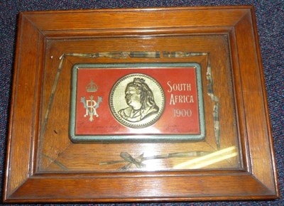 Lot 105 - A Queen Victoria 1900 South Africa Christmas Tin, containing original chocolate bar, mounted in...