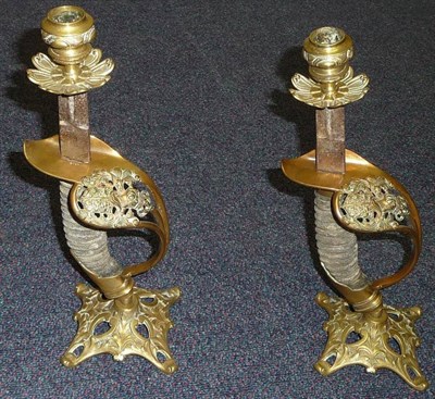 Lot 112 - A Pair of Prussian Sword Hilt Candlesticks, each with a brass nozzle supported on the cut-down...