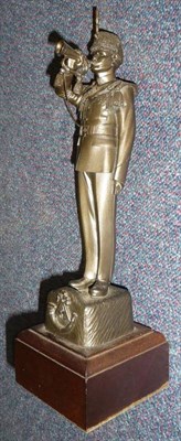 Lot 113 - A Bronzed Resin Figure of a Light Infantry Bugler, standing in dress uniform, a bugle to his...