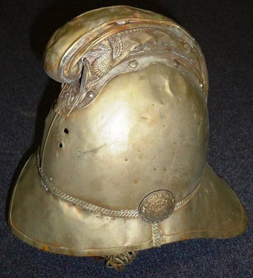 Lot 123 - An Edwardian Fire Officer's White Metal Merryweather Style Helmet, with dragon embossed comb, lacks