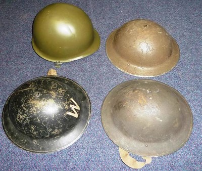 Lot 126 - A Second World War Brodie Helmet, in olive green, the liner stamped VERO I and dated 1939; two...