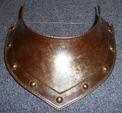 Lot 129 - A 17th Century Style Steel Gorget, with rolled ropetwist edge, the lower border set with nine steel