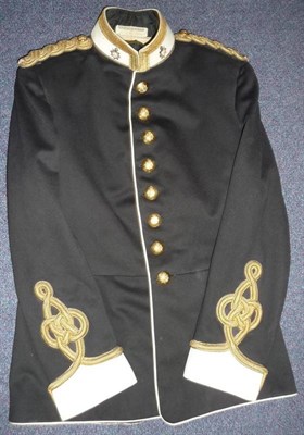 Lot 134 - A No.1 Service Blue Dress Tunic, to a Colonel of the Army Service Corps, with gold lace trimmed...