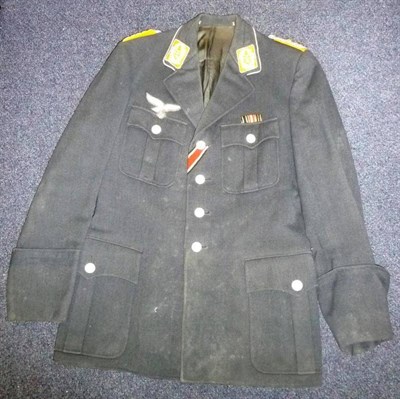 Lot 139 - A German Third Reich Luftwaffe Officer's Tunic, with four button front fastening, four pleated...