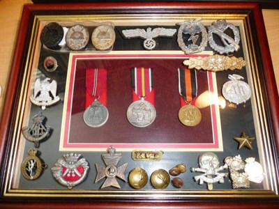 Lot 160 - A Framed Display of Three German Third Reich Medals, comprising Russian Front Campaign, Blood Order