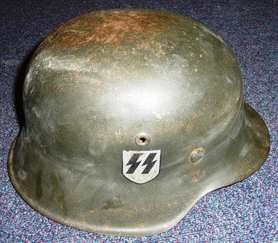 Lot 162 - A Second World War German M1942 Helmet, with single second pattern SS runes decal, with eight...