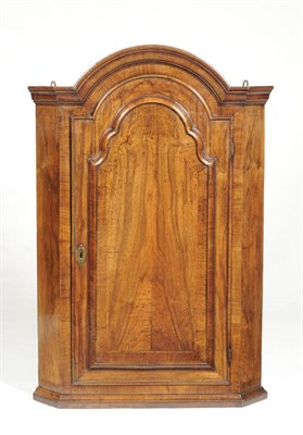 Lot 1581 - A George II Walnut Hanging Corner Cupboard, second quarter 18th century, the domed top with...