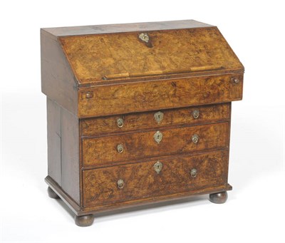 Lot 1583 - A Queen Anne Walnut Bureau, early 18th century, in two parts, the upper section with fall enclosing