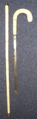 Lot 211 - A 19th Century Ivory Sword Stick, with 39cm double edge diamond shape steel blade, curved...