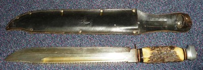 Lot 244 - A German ";Whitby"; Bowie Knife, the 30.5cm hatchet tip steel blade with narrow fuller to the...