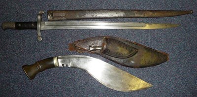 Lot 253 - A Nepalese Kukri, the 32cm deep curved steel blade with narrow top fuller and double notches,...