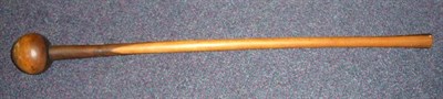 Lot 281 - A Zulu Knobkerrie, with globular head and slightly curved cylindrical haft, 71cm