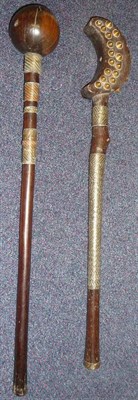 Lot 282 - A Zulu Knobkerrie, with large globular head, the tapering cylindrical haft bound with bands of...