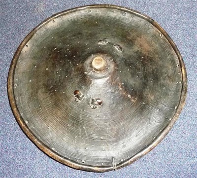 Lot 297 - A Late 19th Century Ethiopian Hide Shield, possibly of rhinoceros hide, of domed circular form with