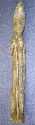 Lot 316 - A Dogon Large Wood Ancestor Figure, of a woman, her long conical head with hooded eyes,...