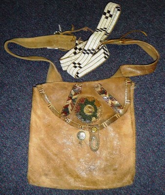 Lot 317 - A North American Indian Hide Running Bag, of square form, the flap set with a starburst rosette...