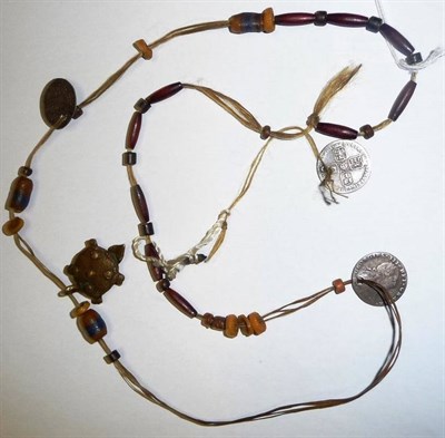 Lot 318 - A Twisted and Waxed Blonde Hair Necklace, possibly North American Indian, set with glass, wood...