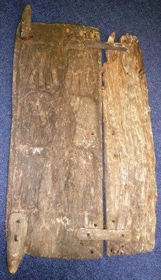 Lot 321 - A Dogon, Mali Granary Door, made up from two rectangular planks, the larger carved with hands...