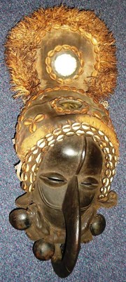 Lot 323 - A Dan, Ivory Coast Zoomorphic Mask, the domed forehead with raised medial ridge, pierced...