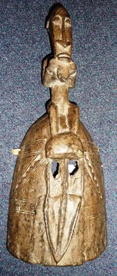 Lot 325 - A Dogon, Mali Wood Mask,  of curved form, carved as a stylised bird with pierced eyes and...