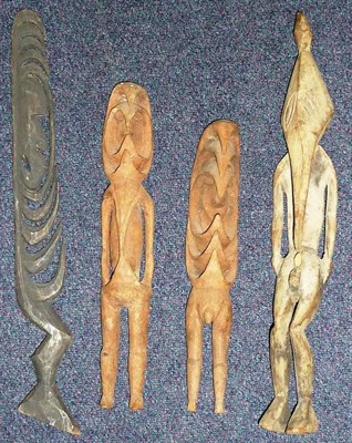 Lot 336 - Four Small Sepik Papua New Guinea Wood Figures:- A Wanleg hook figure, with hooked beak and...