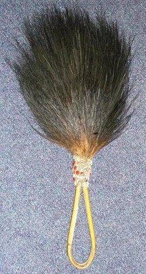 Lot 340 - A Cassowary Feather Fly Whisk, Papua New Guinea, the numerous plumes attached to a looped split...