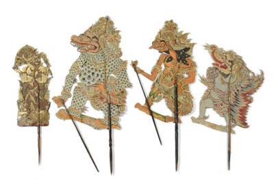 Lot 343 - Four Javanese Wayang Kulit Shadow Puppets, each of intricately tooled and perforated buffalo...