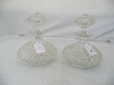 Lot 5 - A Pair of Cut Glass Scent Decanters, circa 1910, of compressed form with radiating lozenge cut,...