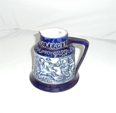 Lot 11 - A J Macintyre Pottery "The Edmonton Bell" Jug, circa 1910, of bell shape, with a continuous frieze