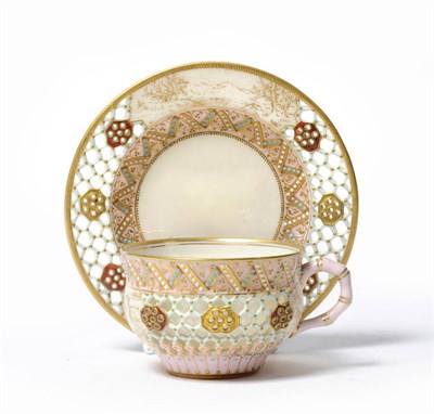 Lot 14 - A Worcester Porcelain Double Walled and Reticulated Cabinet Cup and Saucer, circa 1870-80, the ogee